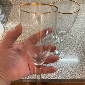 Set of four gold rim wine glasses
